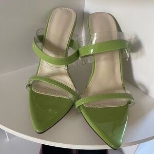 Worn once, green and clear heels